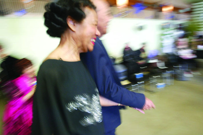 Cindy chew5/20/04A happy couple walks toward the dance floor.